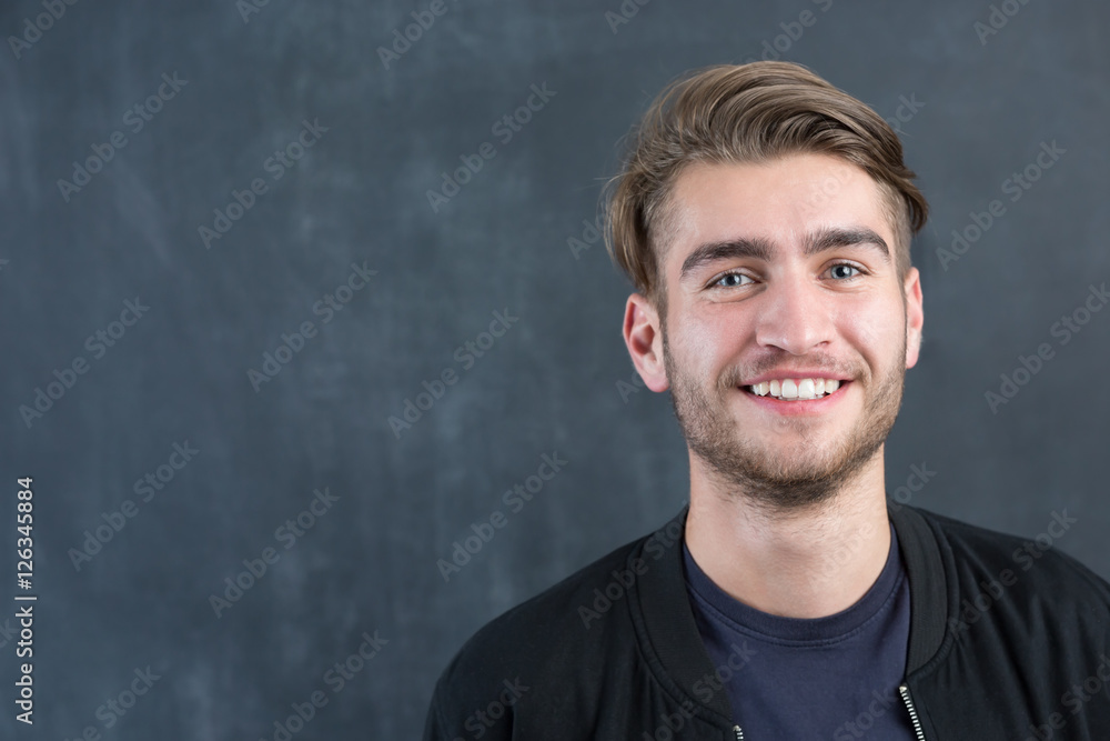 portrait of young startup businessman at modern office, chalkboa