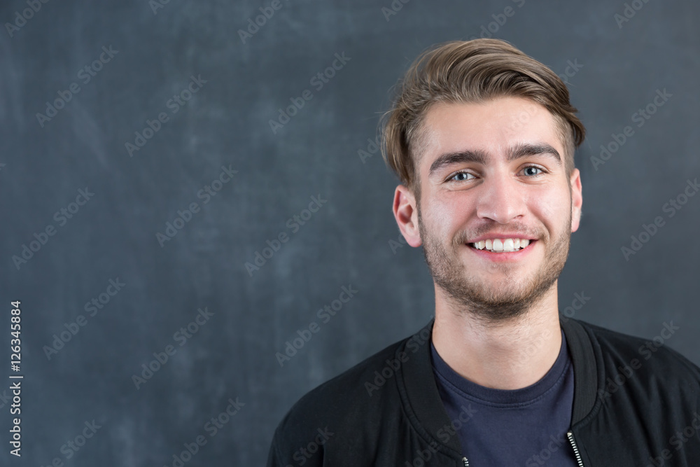 Fototapeta premium portrait of young startup businessman at modern office, chalkboa