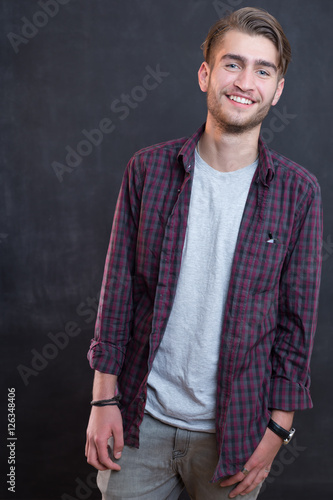 Wallpaper Mural sexy fashion man or student dressed casual smiling against chalk Torontodigital.ca