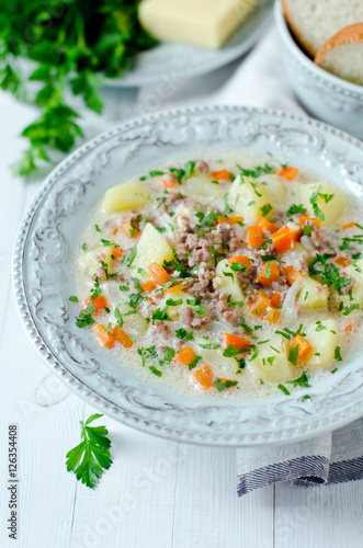Cheese soup with vegetables and minced meat