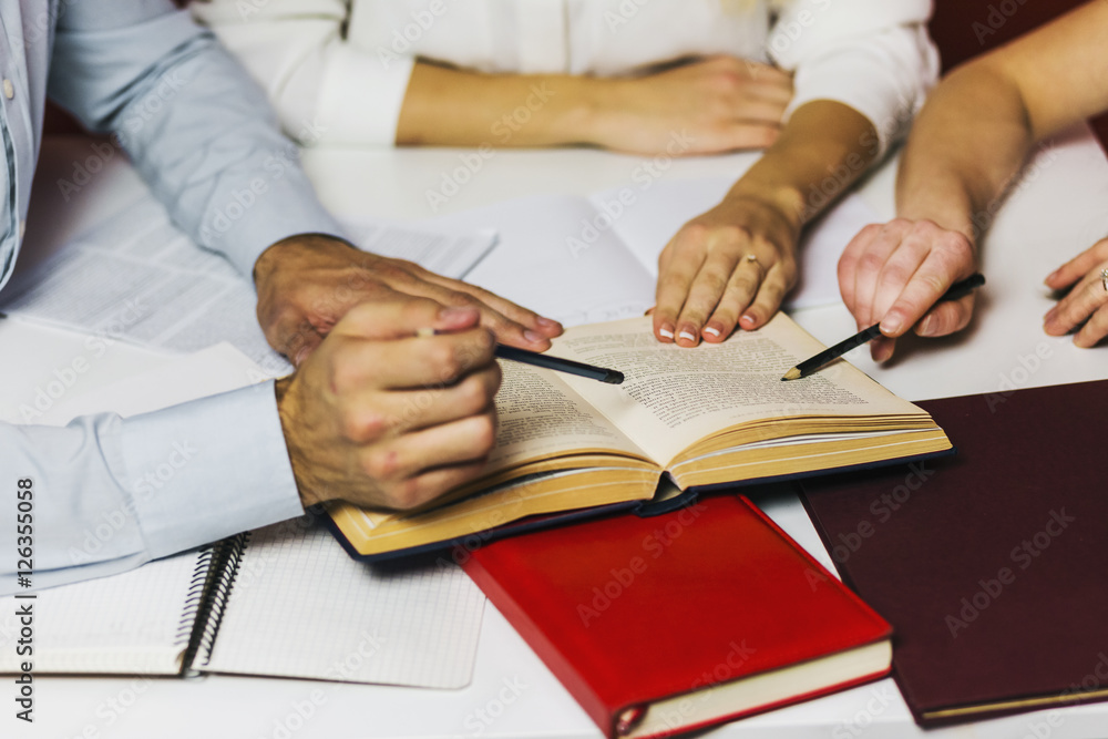 A group of young attractive students have a friendly discussion, teamwork student concept A group of young attractive students have a friendly discussion, teamwork student concept