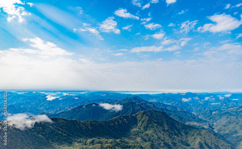Fototapeta premium Clouds float over the mountians
