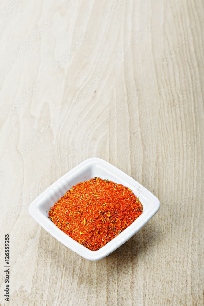 Red spice mixture on wood Red spice mixture on wood