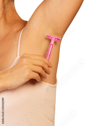 Hand woman shaves armpit disposable razor isolated on white.