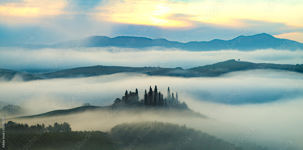 the famous Tuscan landscape at sunrise