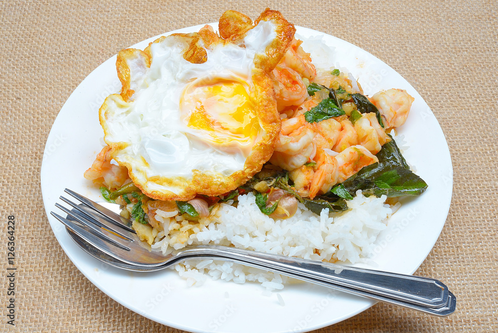 fried shrimps with chilli paste and basils, rice and fried egg topping
