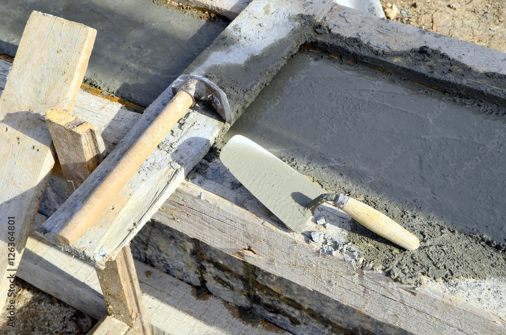Construction tool in a construction site,trowel ,concrete Construction tool in a construction site,trowel ,concrete