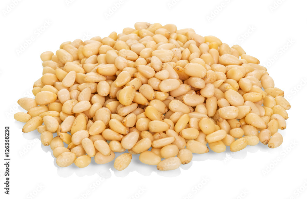 Pile of pine nuts closeup isolated on white background. Pile of pine nuts closeup isolated on white background.