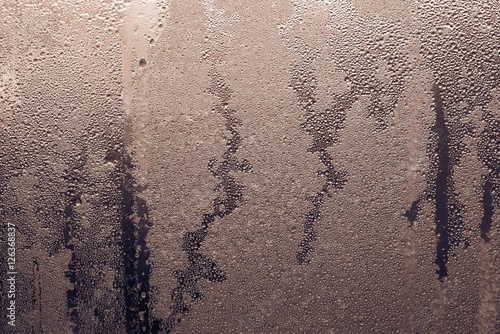 abstract texture of wet glass brown color