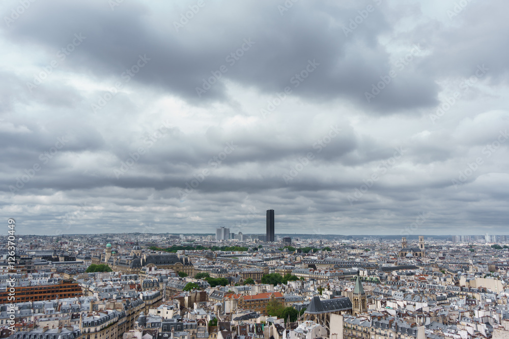 Montparnasse tower over Paris, cloudy day