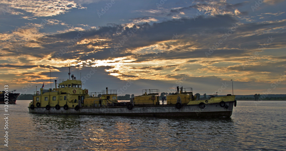 barge on the River Cama at sunset