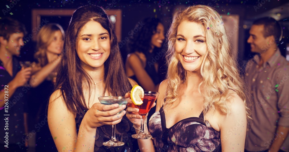 Composite image of portrait of friends having a drink