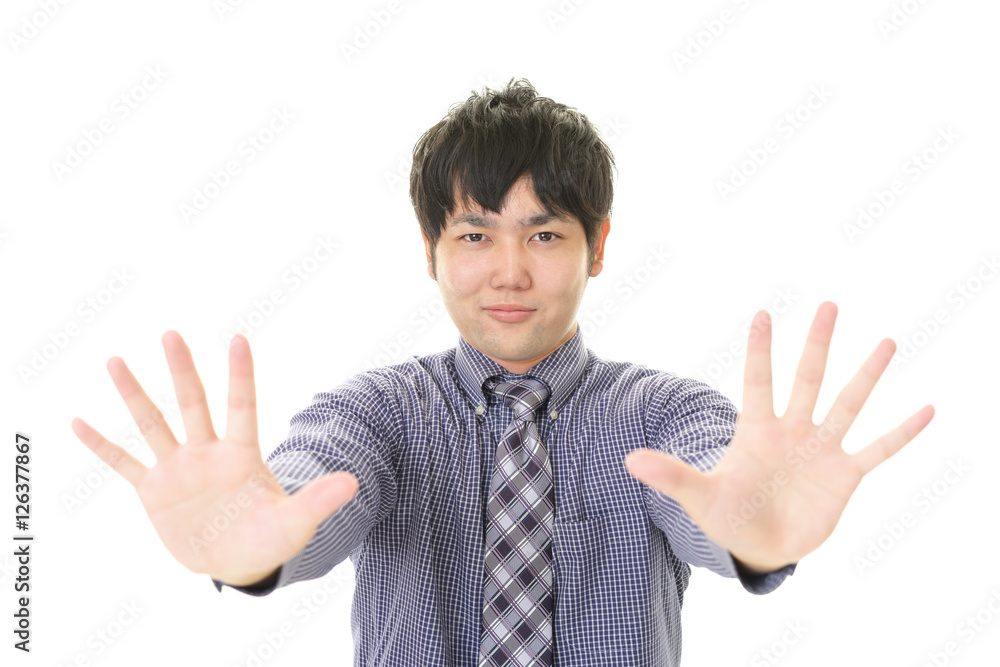 ストップのジェスチャーをする男性
