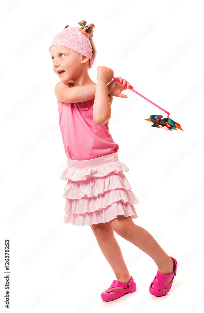 Little cute girl holding windmill isolated on white background. Little cute girl holding windmill isolated on white background.