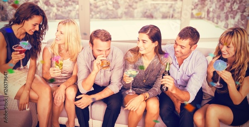 Canvas Print Composite image of group of friends talking and having drinks