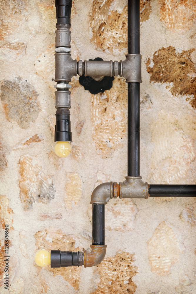 Pipes on the background of a stone wall Pipes on the background of a stone wall