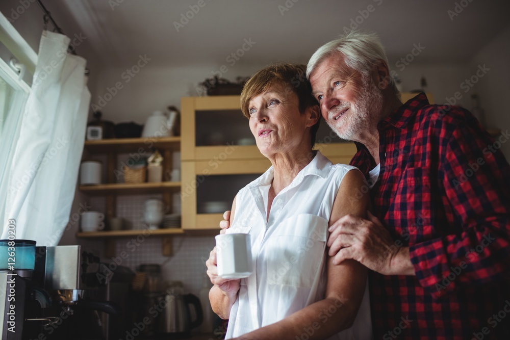 Senior couple standing in kitchen Senior couple standing in kitchen