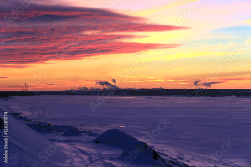 red sunset over the winter river