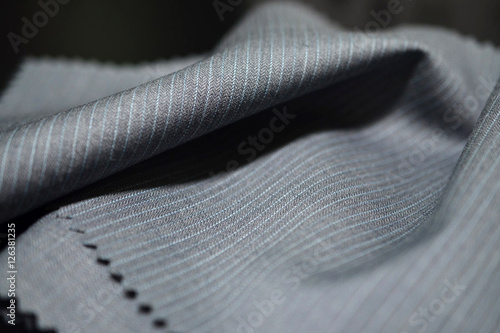 close up texture gray fabric with blue line of suit