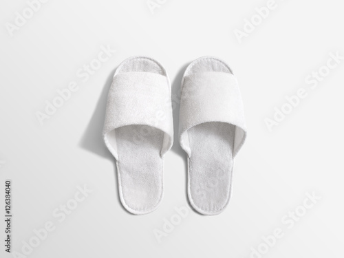 Pair of blank white home slippers, design mockup. House plain flops mock up template top view. Clear domestic sandal. Bed shoes accessory footwear.