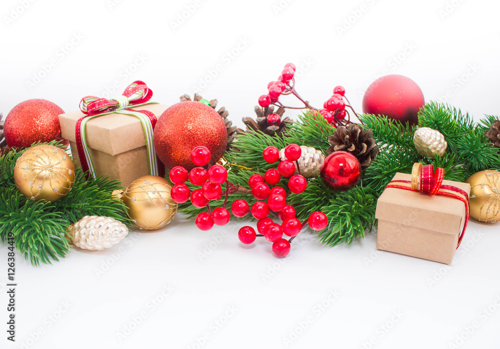 Christmas or New Year background: fur-tree, branches, gifts, colored glass balls, decoration and cones on a white background