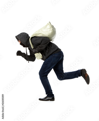 Thief runs with gray bag