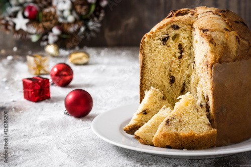 Tablou pe pânză Christmas cake panettone and Christmas decoration on wooden background