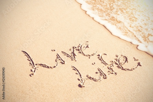 Canvas Print Live life written text on sand