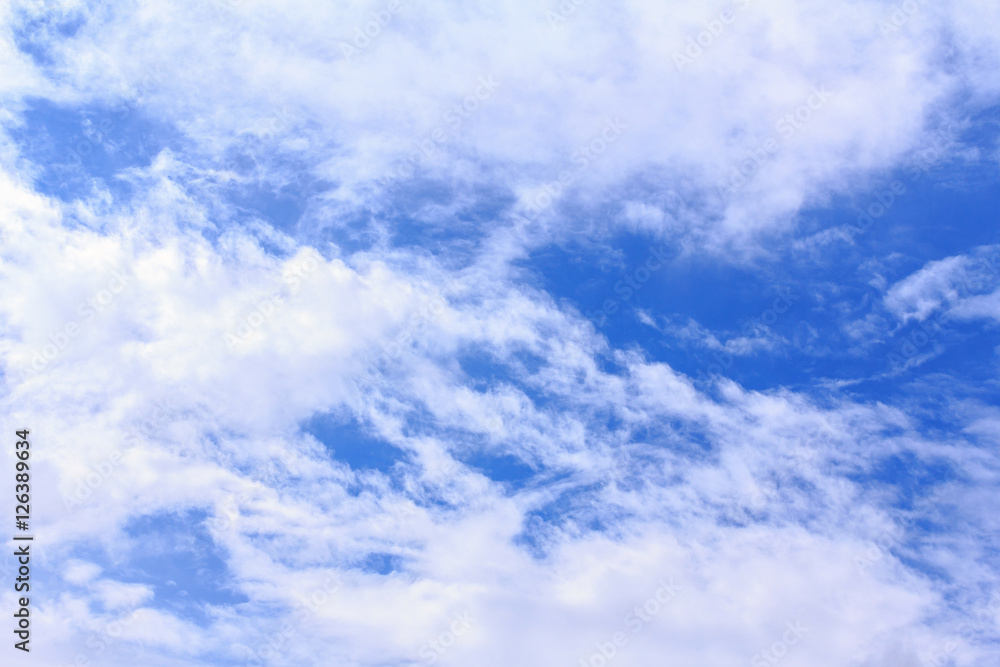 Fototapeta premium Blue sky background with white clouds. The vast blue sky and clouds sky on sunny day. White fluffy clouds in the blue sky.
