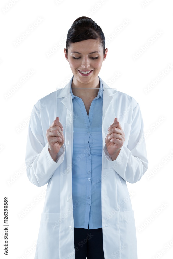 Beautiful female doctor holding digital tablet