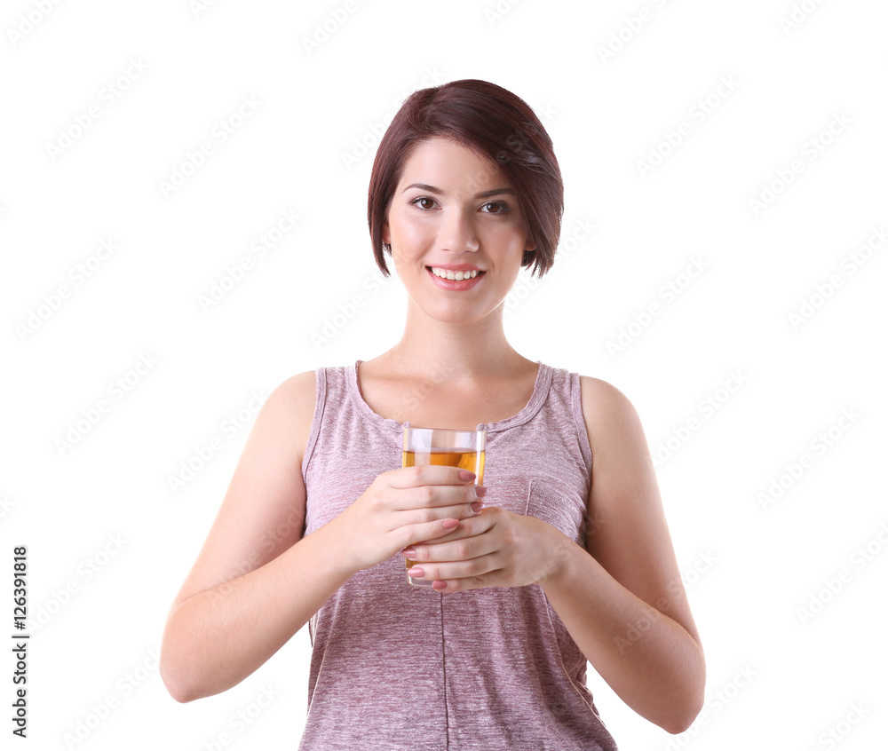 Young beautiful woman with glass of apple juice, on light background Young beautiful woman with glass of apple juice, on light background