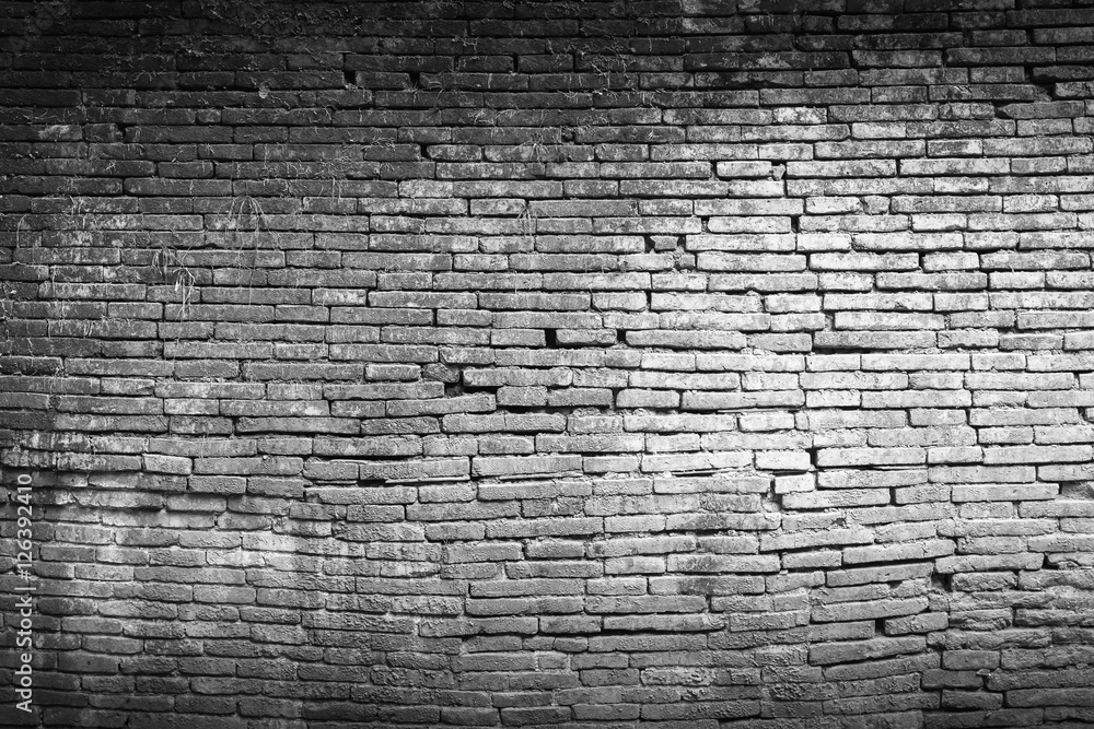 Brick wall texture or brick wall background. Closeup brick wall for design with copy space for text or image. Abstract brick wall detail. Dark edged.