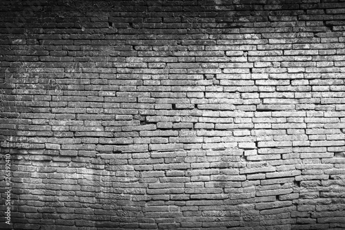 Brick wall texture or brick wall background. Closeup brick wall for design with copy space for text or image. Abstract brick wall detail. Dark edged.