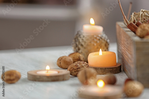 Candle on wooden stand, closeup
