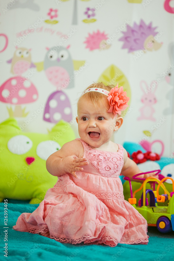 Fototapeta premium The baby playing with toys in room