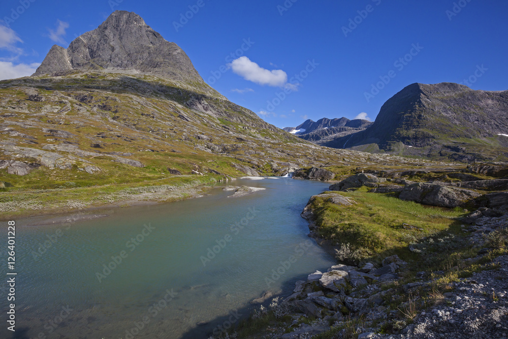 Small mountain lake over peaks and ridges, Trollstigen, Norway