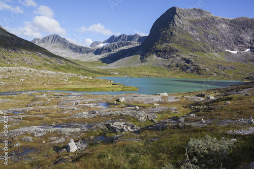 Small lake in high mountain valley, Trollveggen, Norway