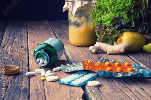 Wallpaper Mural Choice between vitamins from supplements or from vegetables and fruits Torontodigital.ca