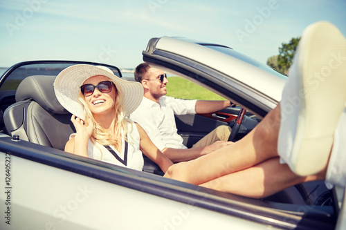 happy man and woman driving in cabriolet car © Syda Productions