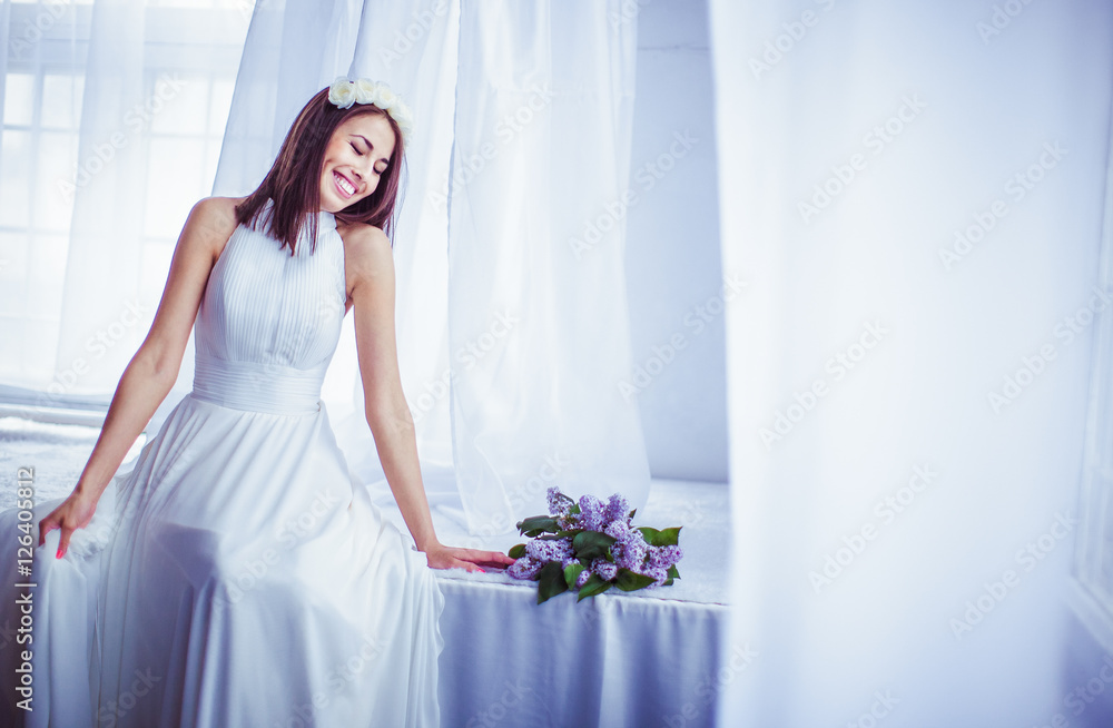 The tenderness bride sits near bouquet The tenderness bride sits near bouquet