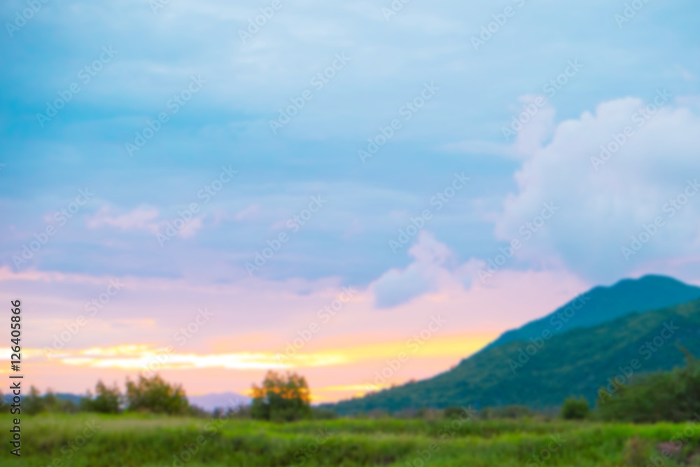 Defocused Mountain and sky sunset.Background texture.