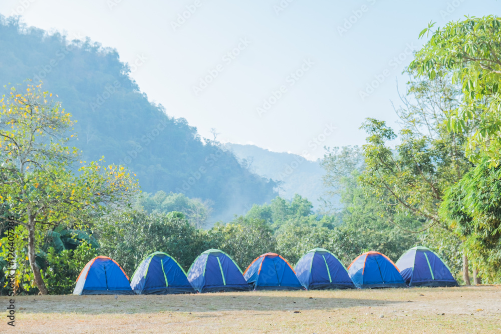 Camping and tent with beautiful nature mountain and sunrise.