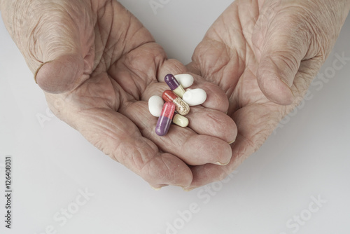 holding pills on palm
