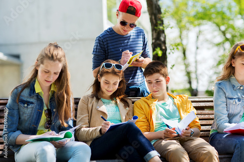 group of students with notebooks at school yard