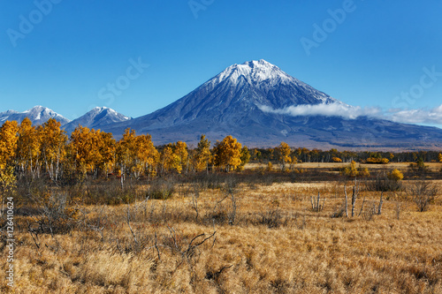 Autumn landscape: view of volcano and blue sky on sunny day