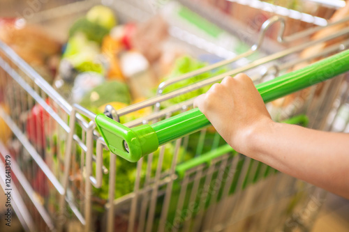 Woman with shopping cart. photo