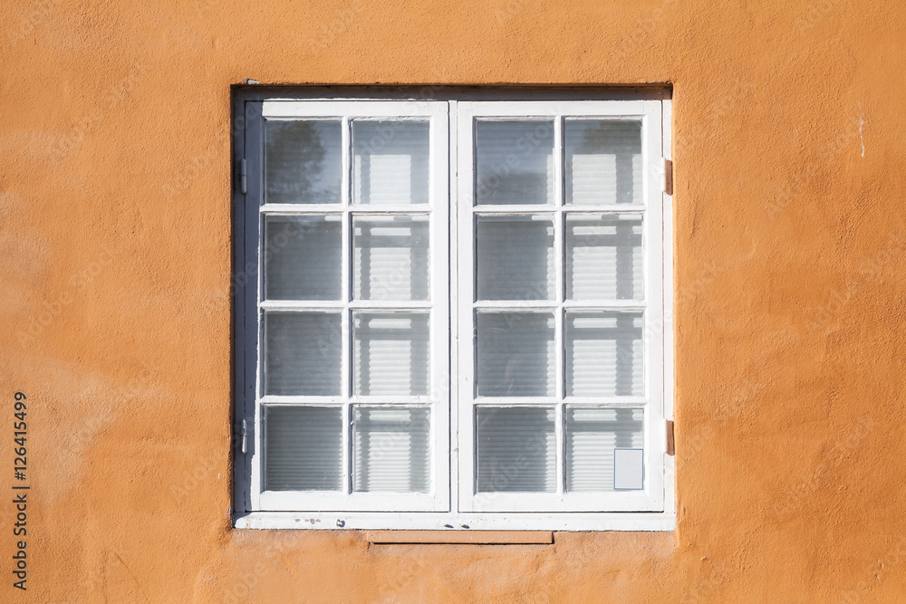 Square window in white wooden frame
