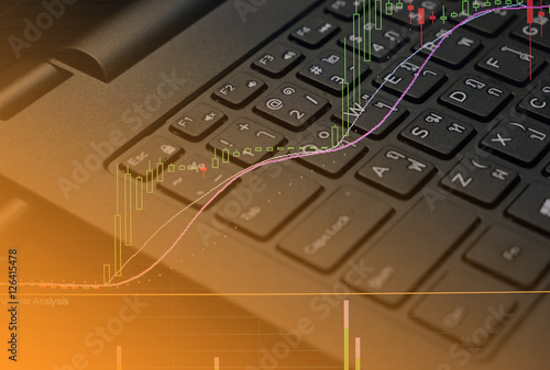 finance data on keyboard computer and graph business concept canuse for background photo