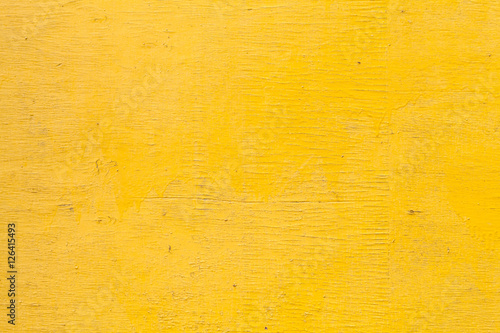 Bright yellow wooden wall texture photo