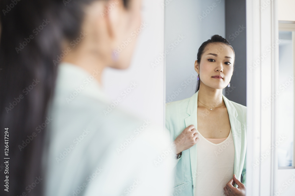 A business woman preparing for work, waking up and dressing. A business woman preparing for work, waking up and dressing.